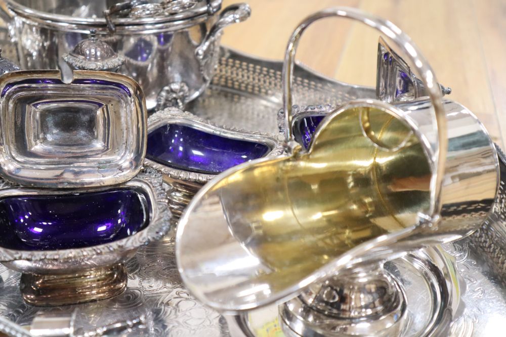 A large oval plated galleried tray and a collection of plated items,